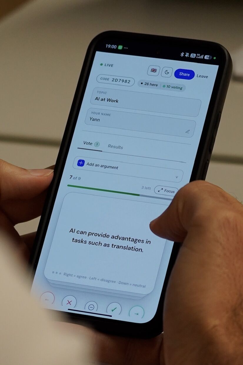 Murmi in use on a phone at Swiss AI Futures. The participant is reviewing a statement about AI and translation.